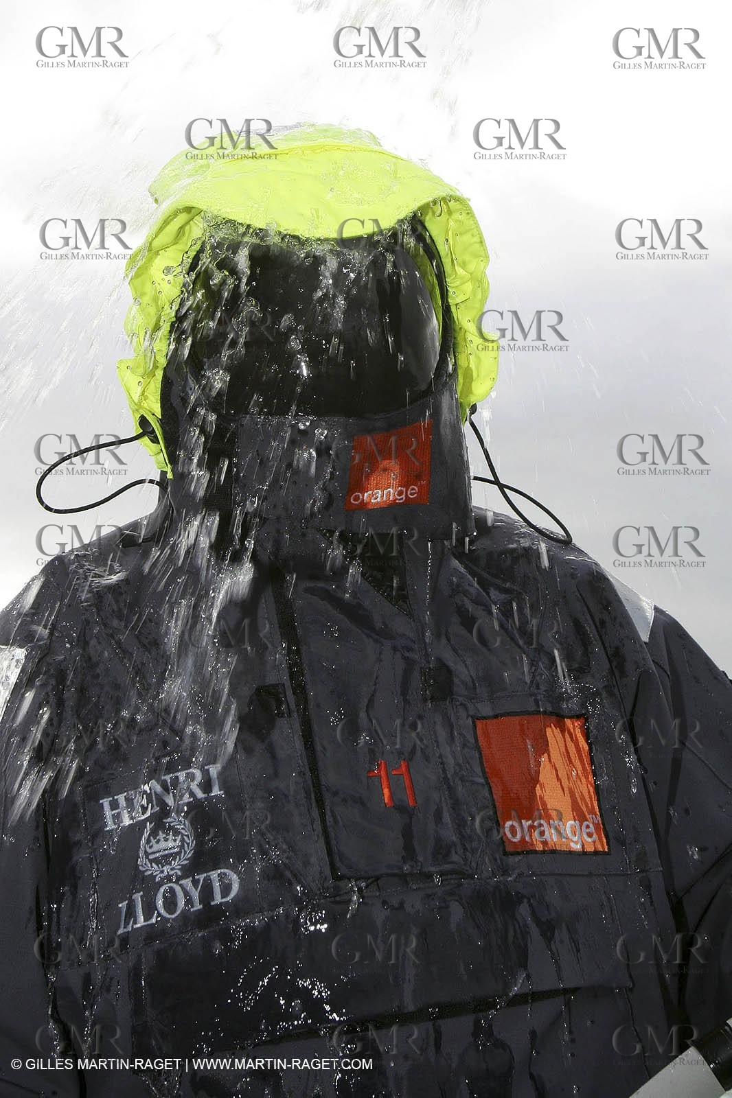 Orange II  - 2005 Jules Verne Trophy - Training in Bay of Biscay - Lionel Lemonchois + helmsan strong wind helmett-