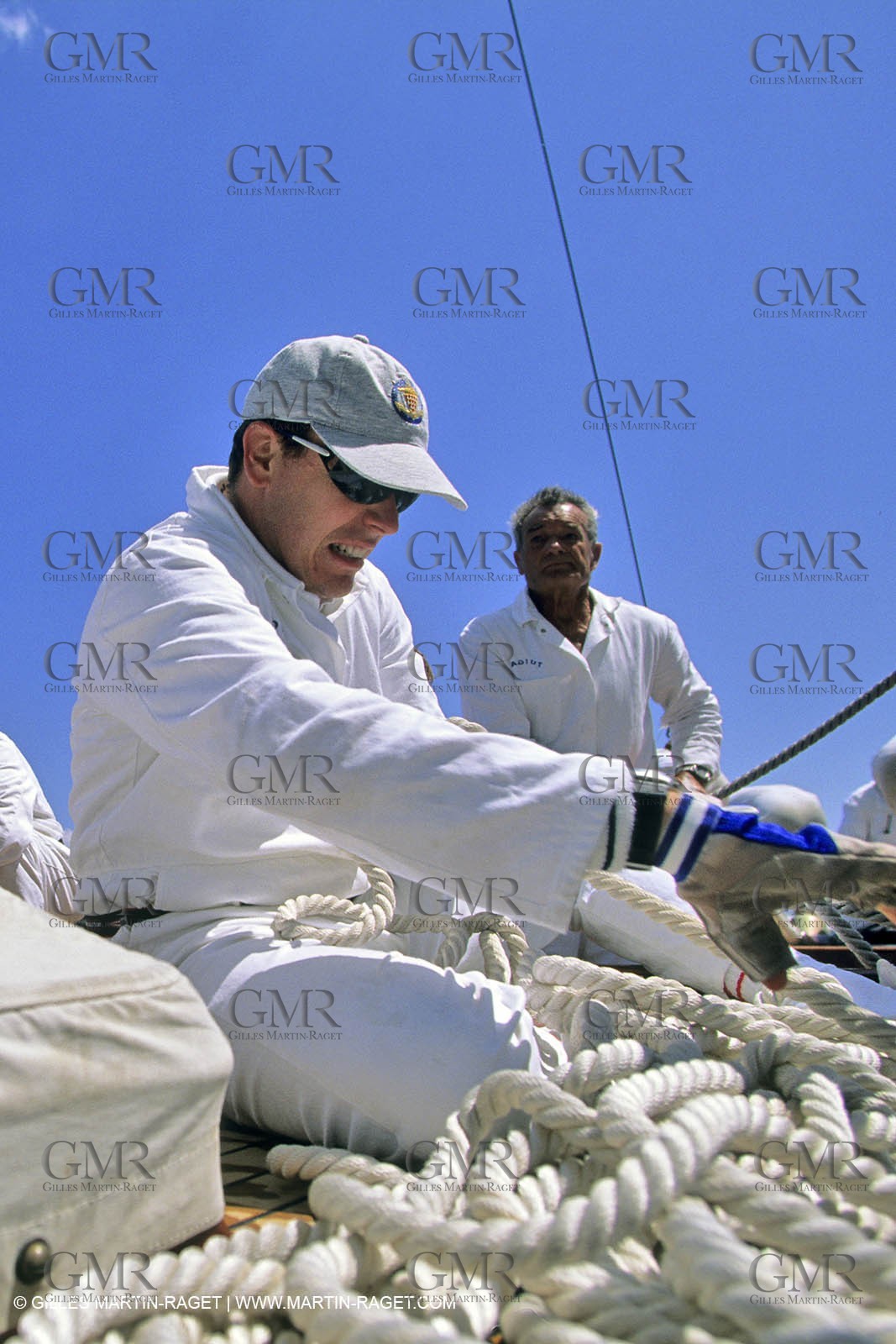 May 1996 - Cannes (FRA, 06) Albert of Monaco manoeuvering onboard Tuiga with Eric Tabarly Steering